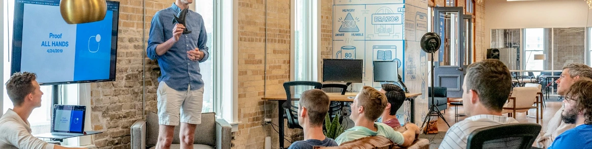 man standing in front of group of men